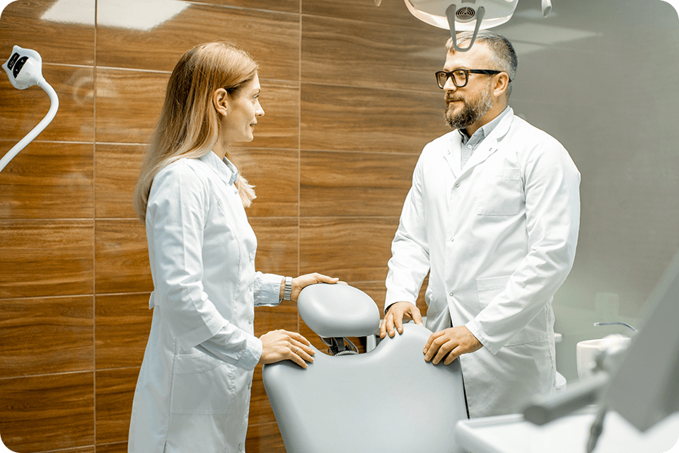male and female dentists discussing the dental office's reputation